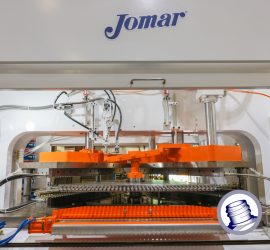 Wide angle view of a Jomar 175ton blow molding machine.